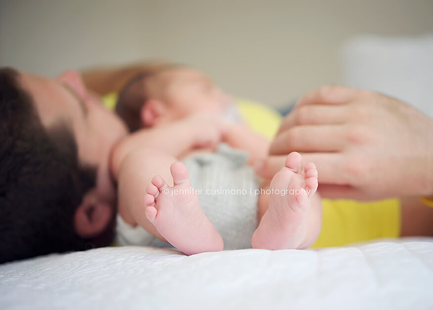 Jennifer Cusimano newborn baby boy on bed with his dad