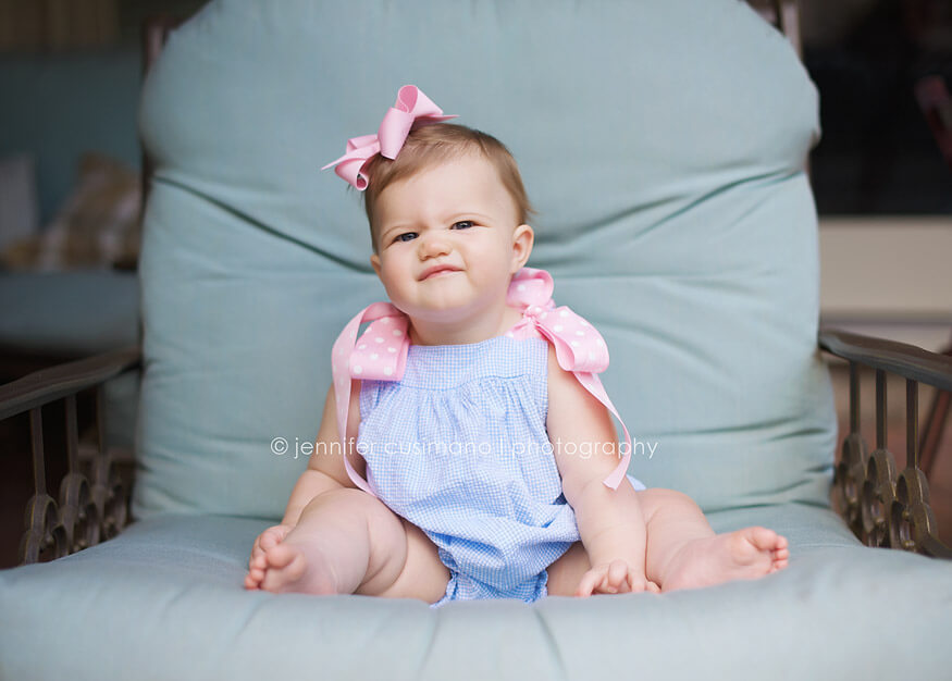 9 month old baby girl in blue chair