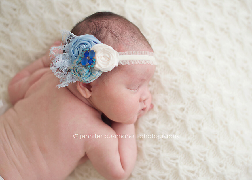 baby girl with baby blue hair bow