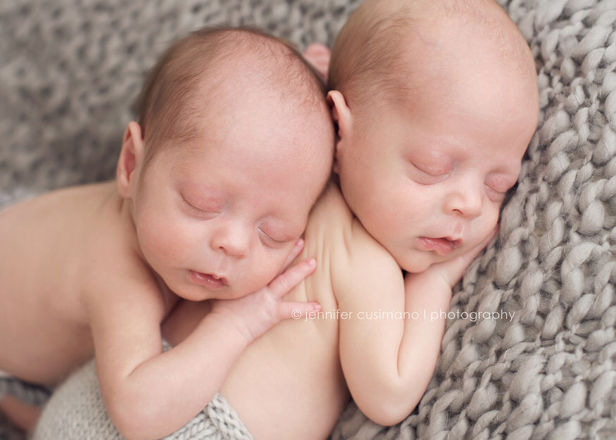 baby boys photographed on gray blanket 
